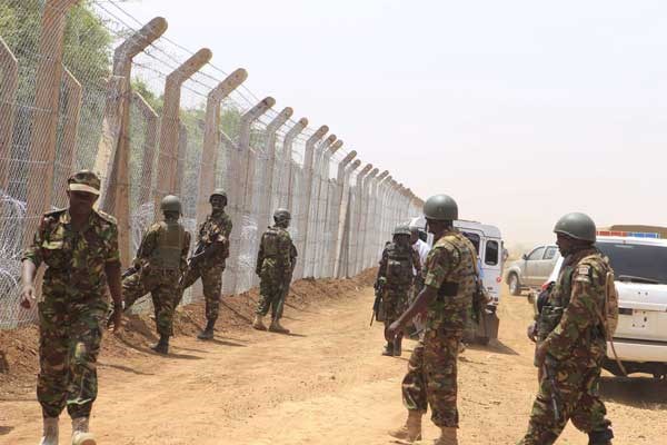 KDF soldiers on guard as the erection of a security fence along the Kenya-Somalia border goes on. NIS has said that terrorism remains the biggest threat to Kenya’s national security and development. PHOTO | MANASE OTSIALO | NATION MEDIA GROUP